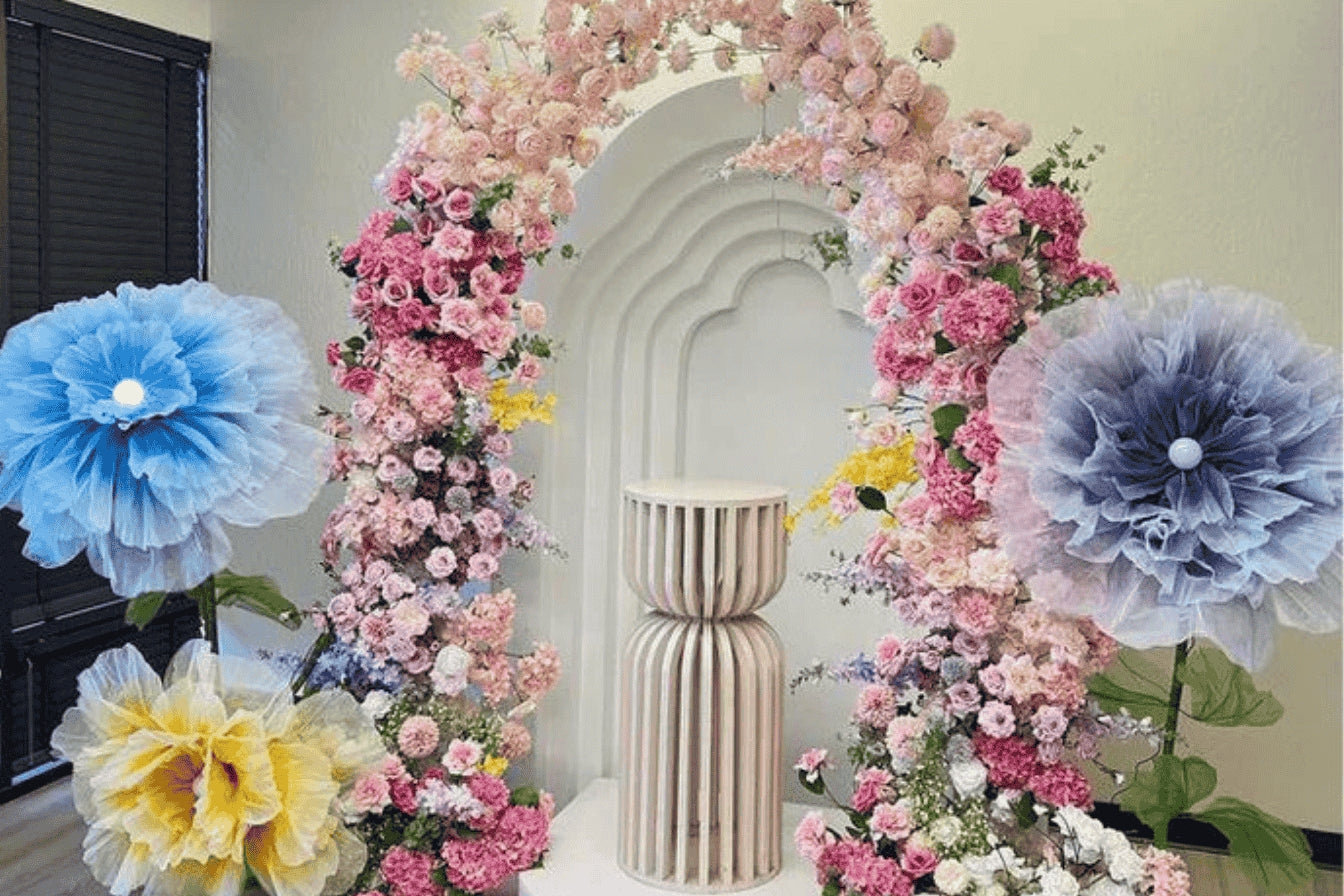 The pink flower arch with giant flower decoration.