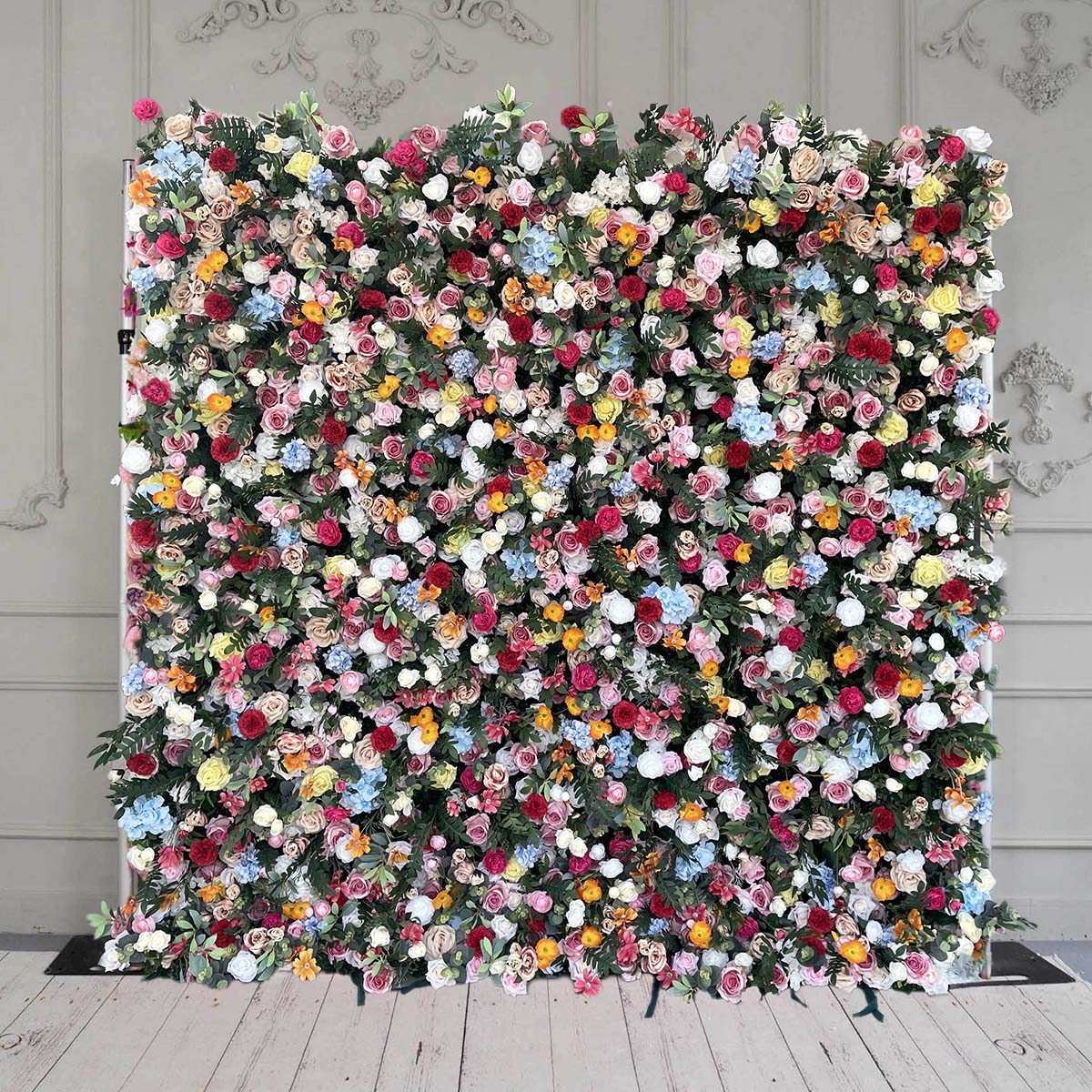 The colorful rose & green leaves flower wall features a fabric backing, ensuring lifelike shapes and vibrant colors. 