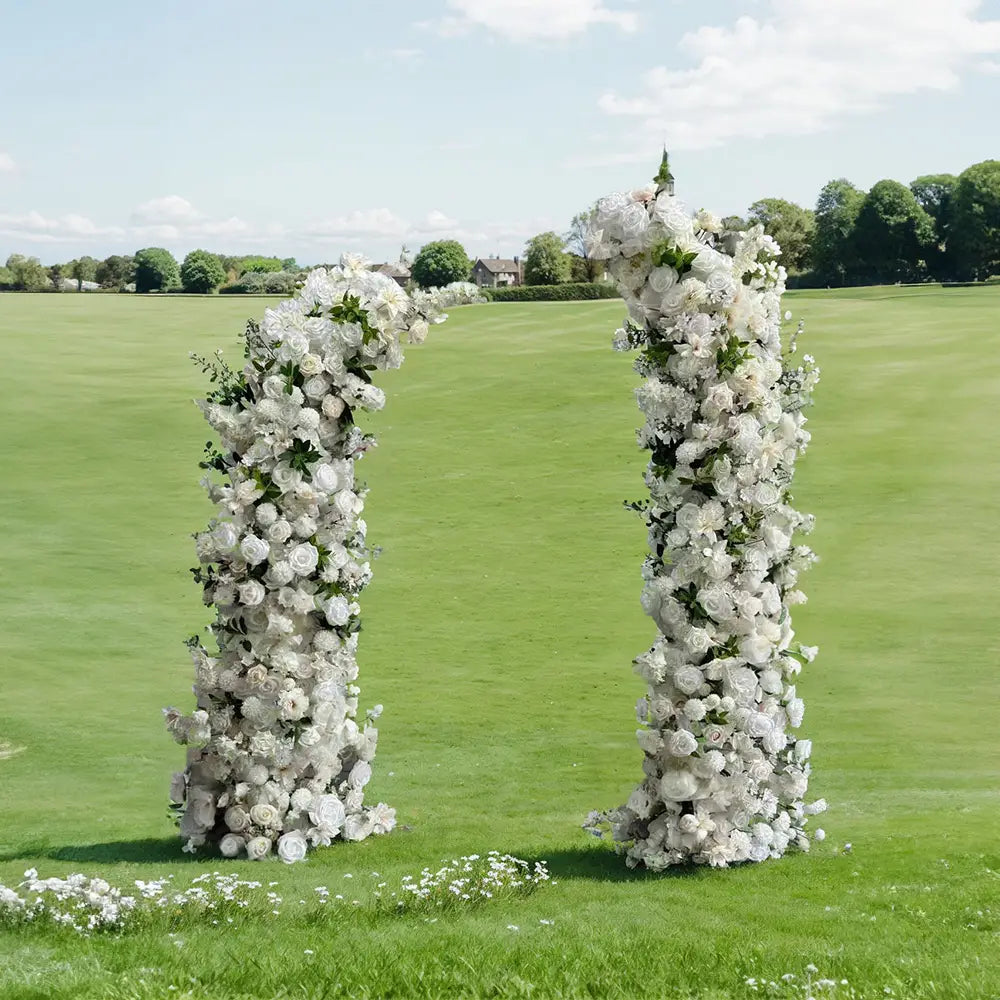 White roses floral pillars for party decor including frame.