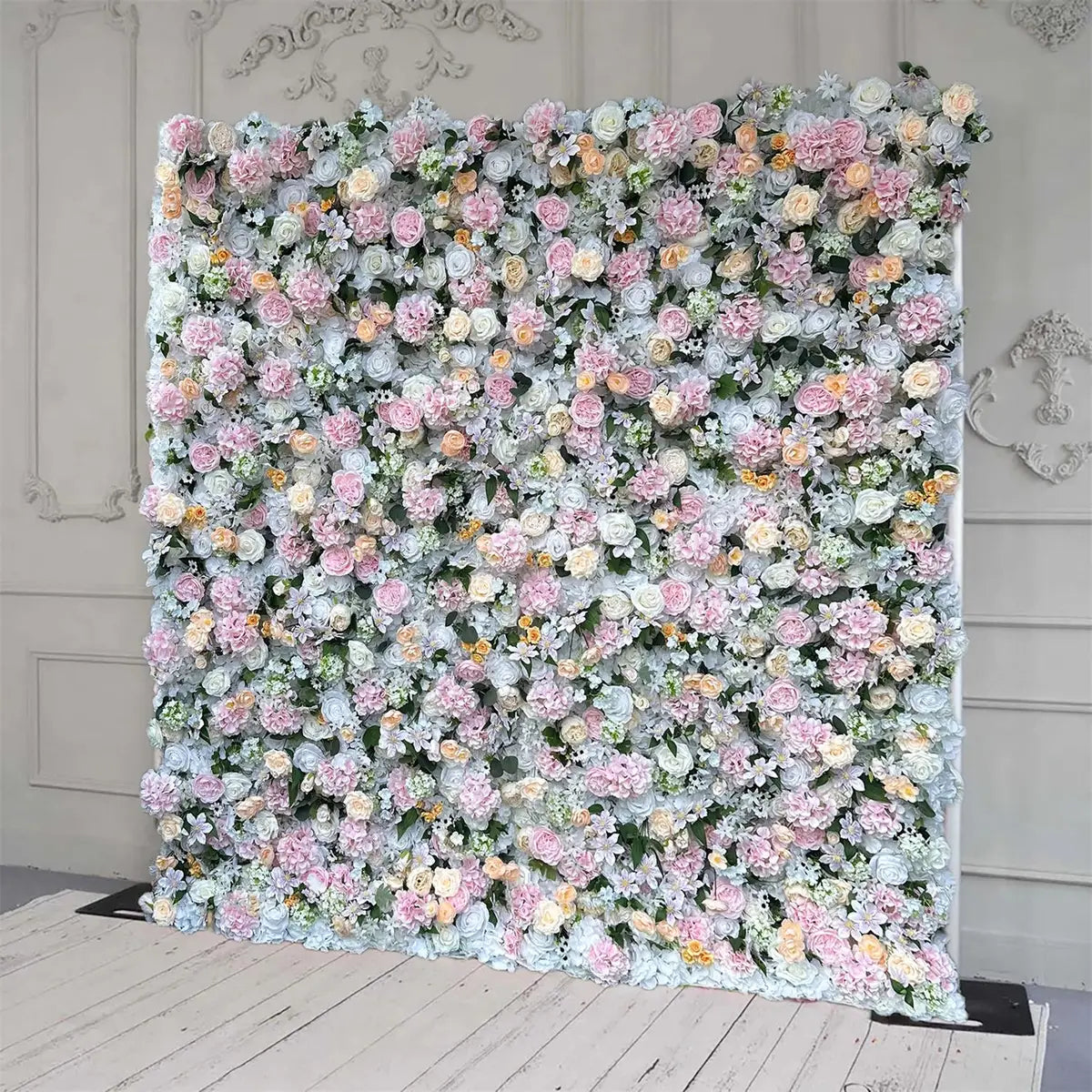 The pink white and champagne flower wall's side view boasts realistic shapes and a fabric backing.