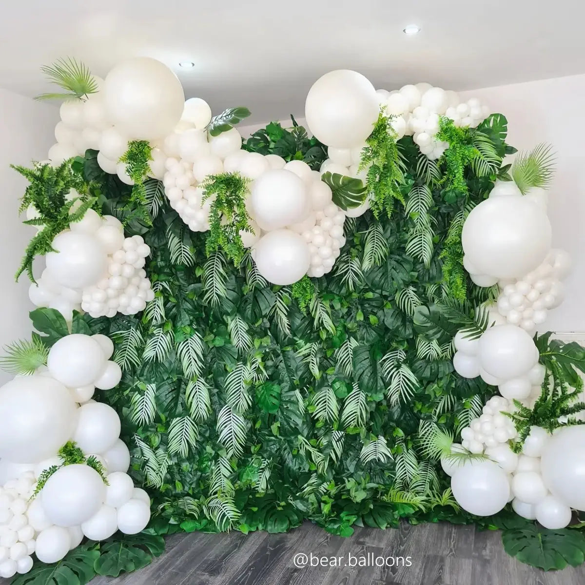 Green flower wall with balloons