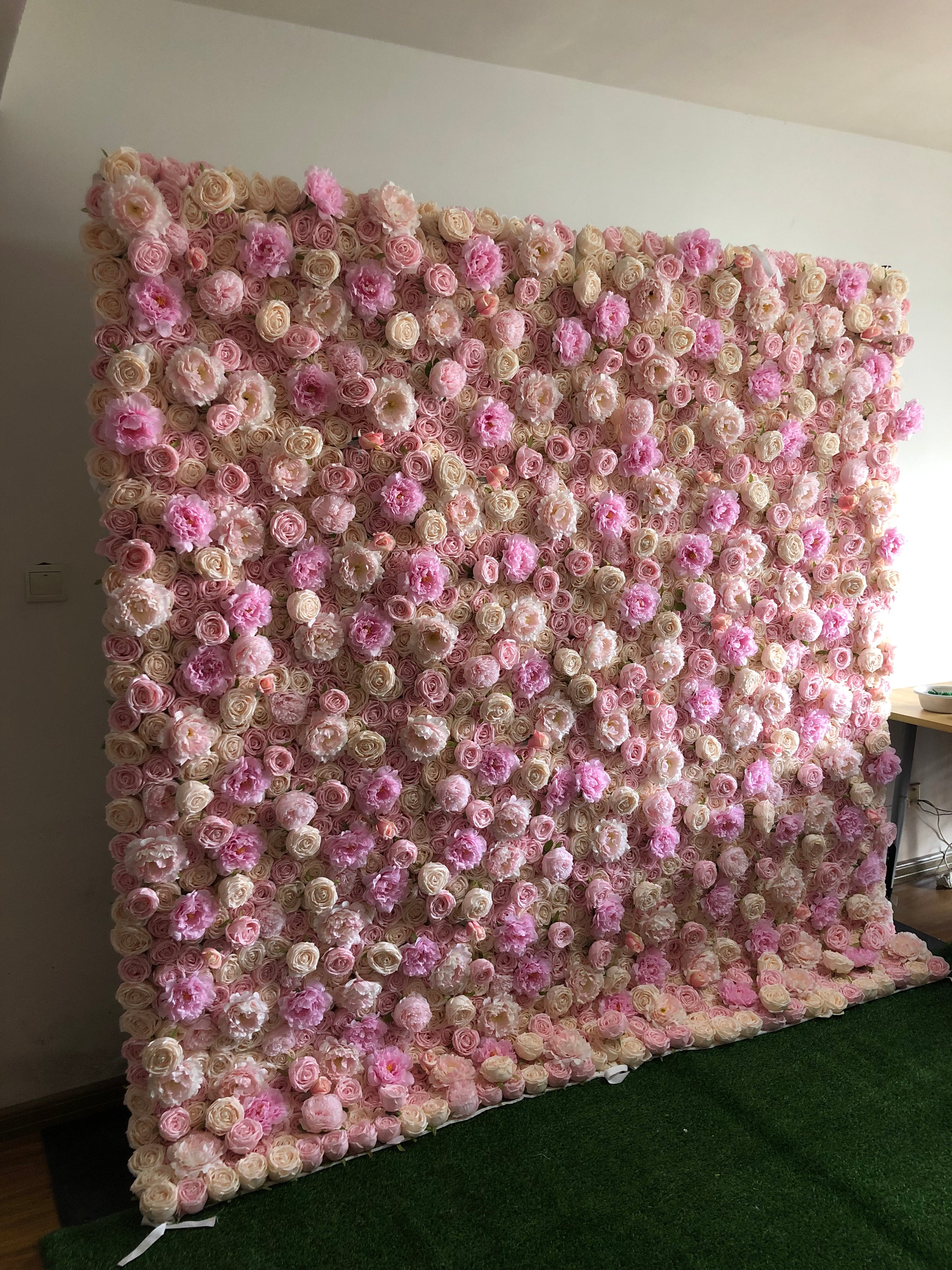 The pink champagne peony fabric flower wall looks cute and romantic.