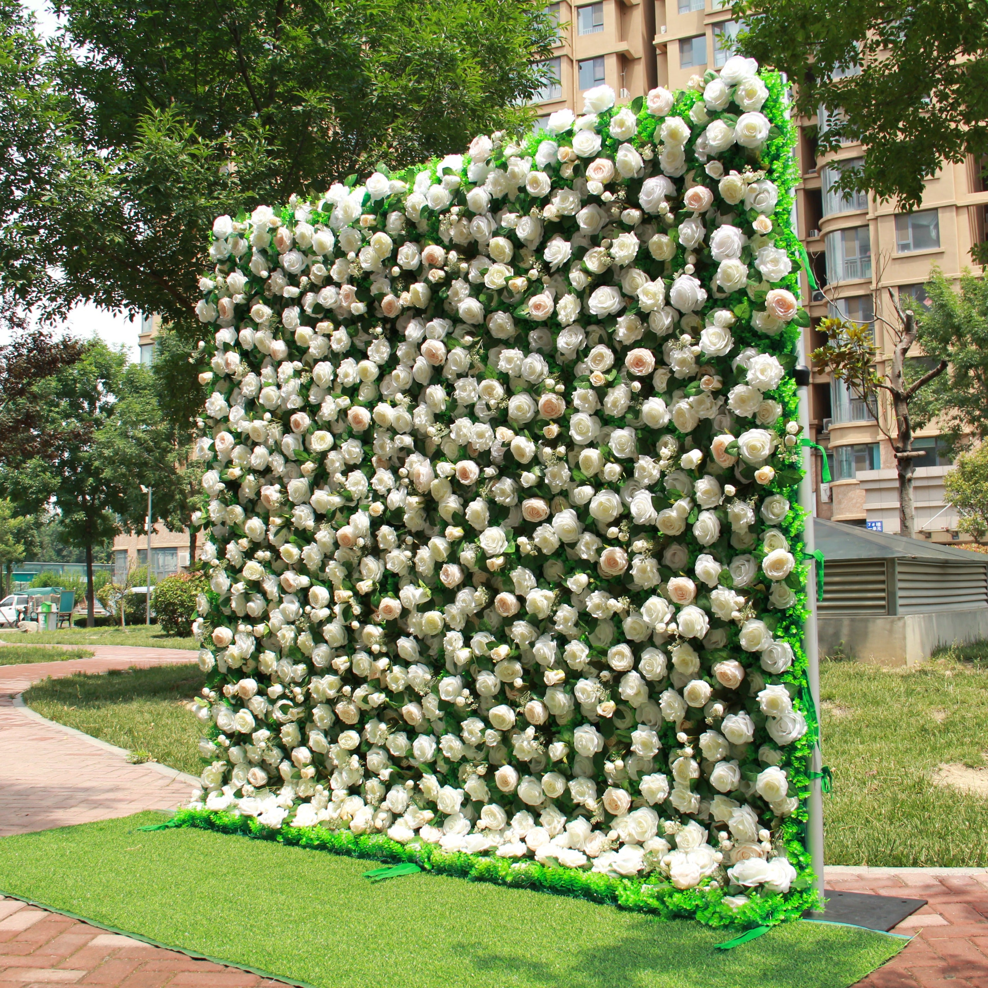 The champagne rose green fabric flower wall looks elegant and beautiful.