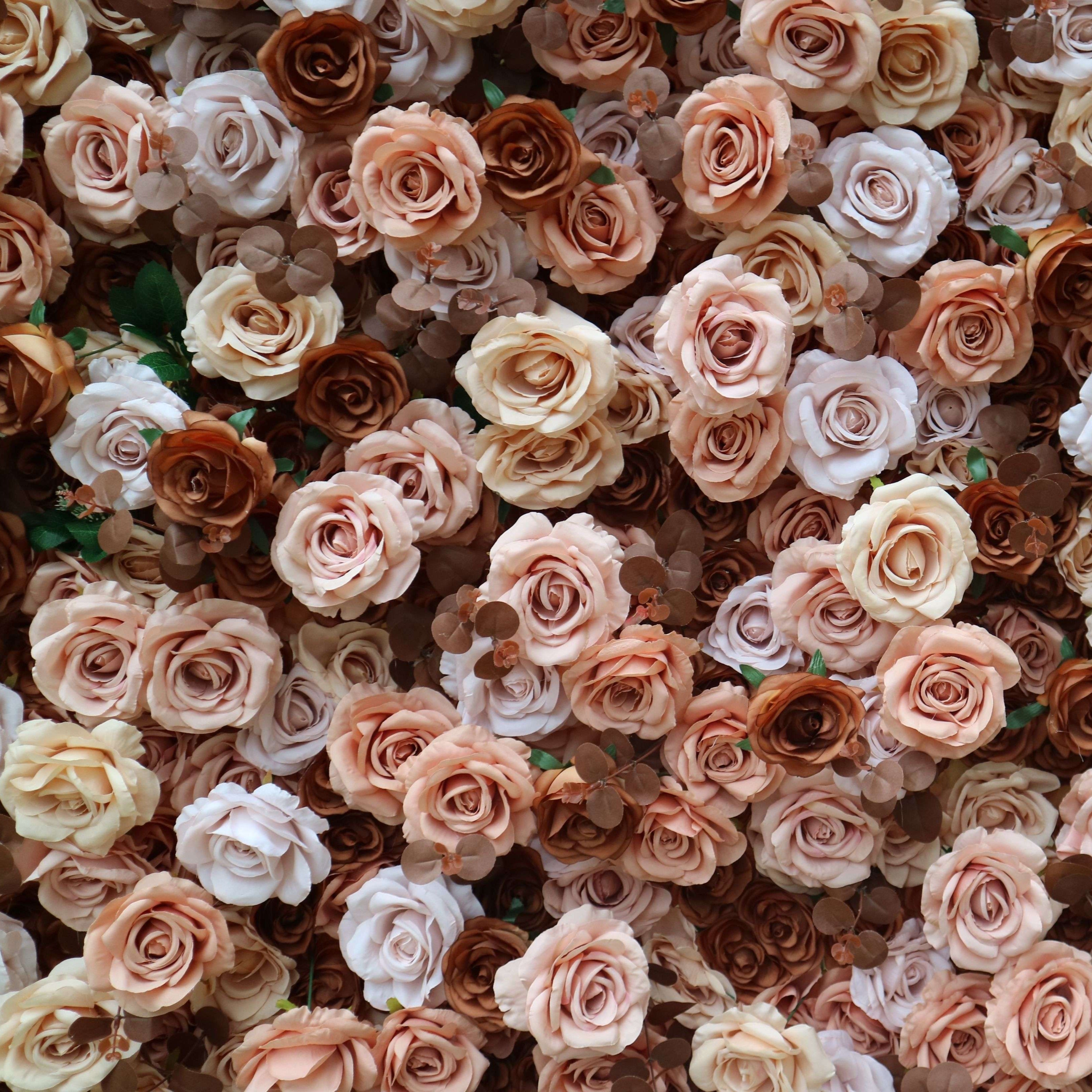 The coffee champagne flower wall backdrop looks romantic.