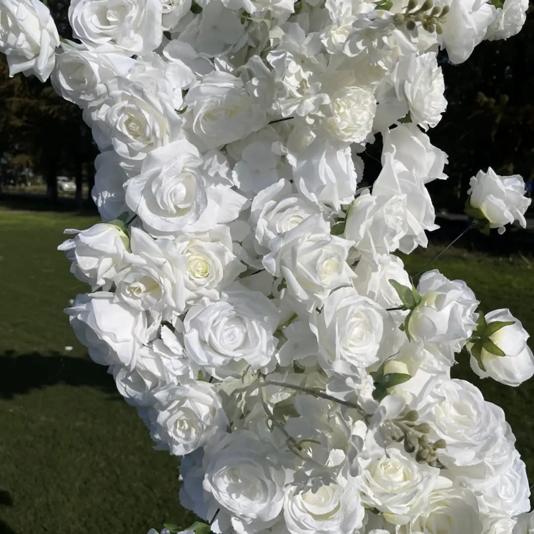 Artificial white roses for flower arch.