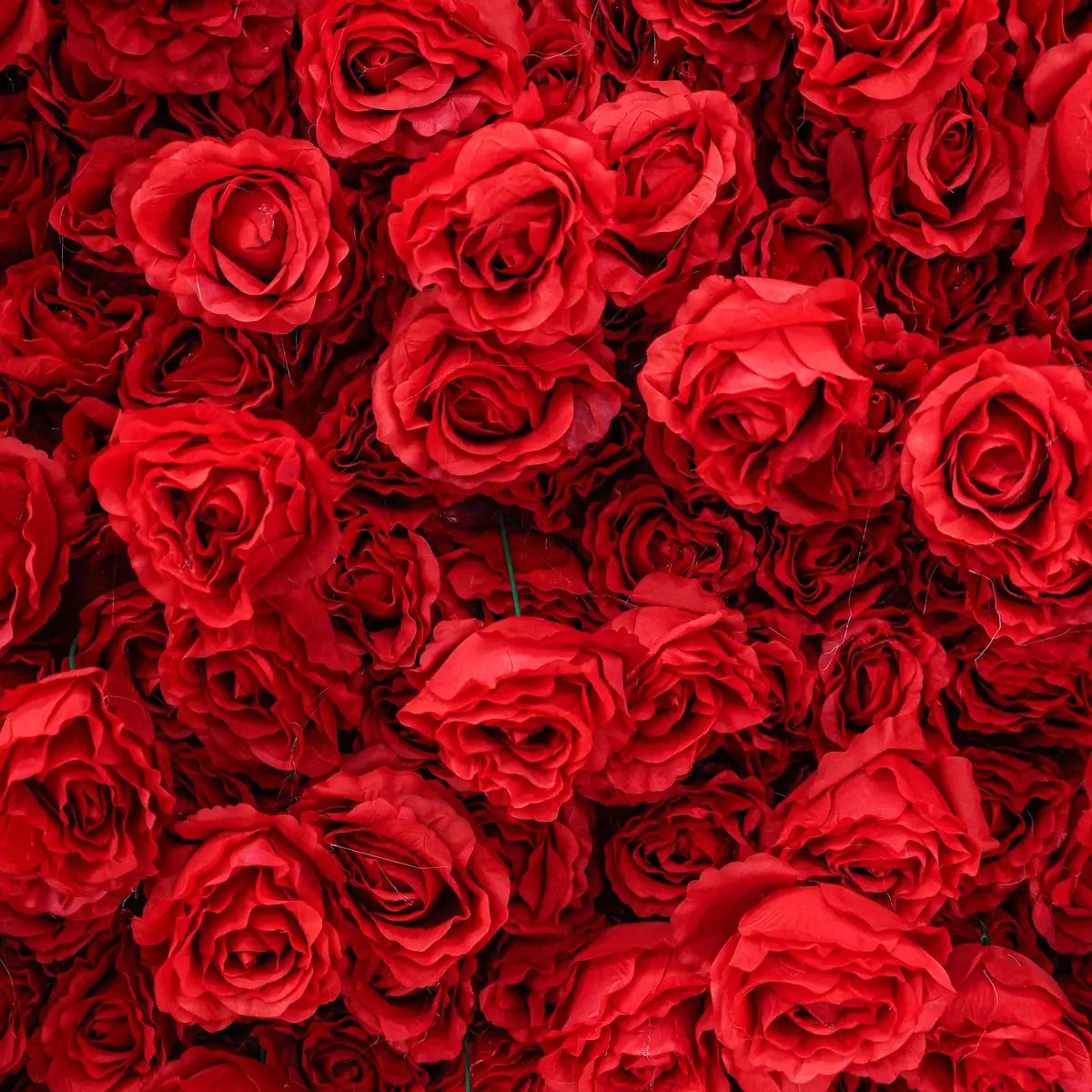 The 3D red roses flower wall detailed view highlights its vibrant, realistic shapes and fabric backing.