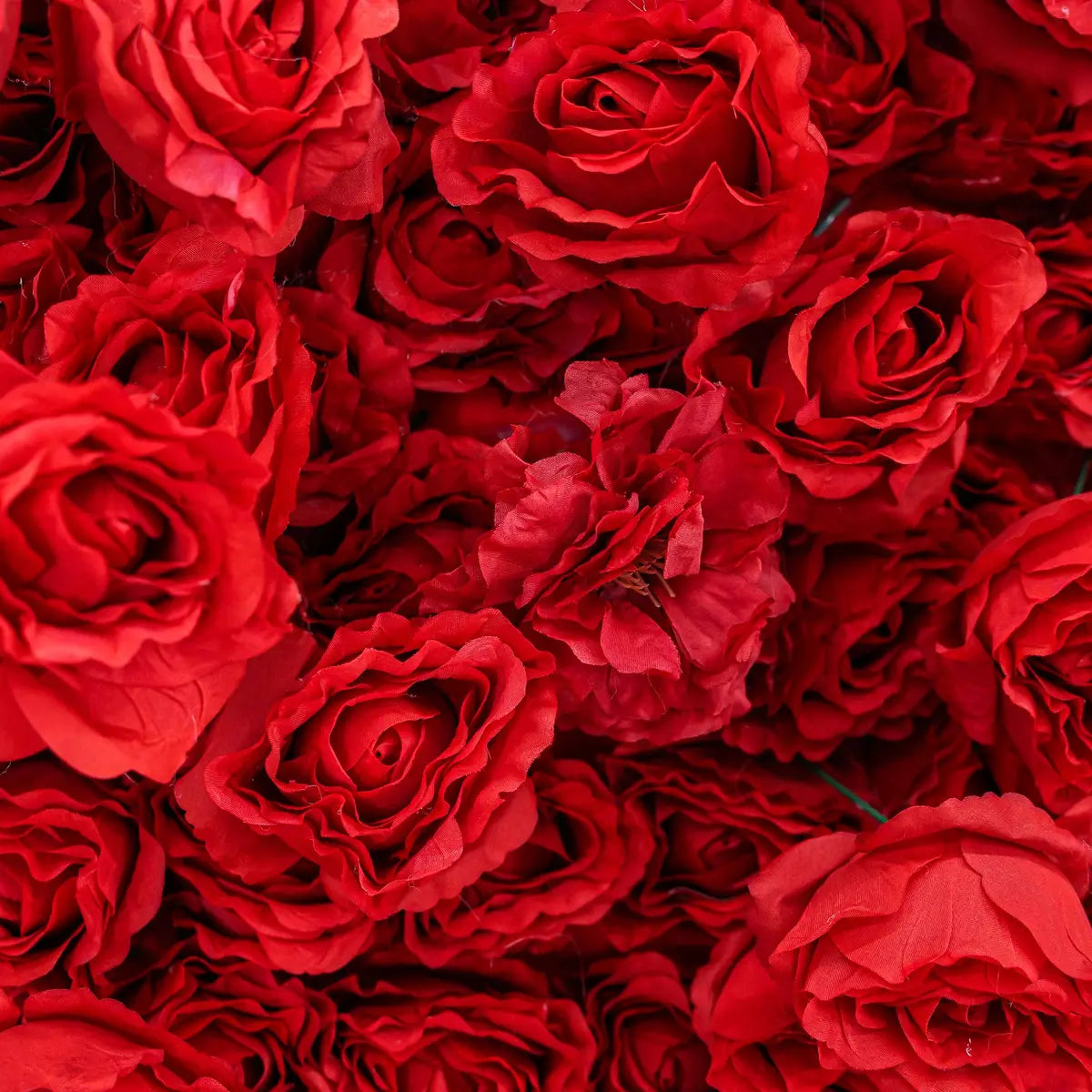 The 3D red roses flower wall detailed view highlights its vibrant, realistic shapes and fabric backing.