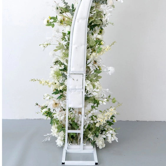 Vibrant colors give the white flower arch detailed realism and beauty.