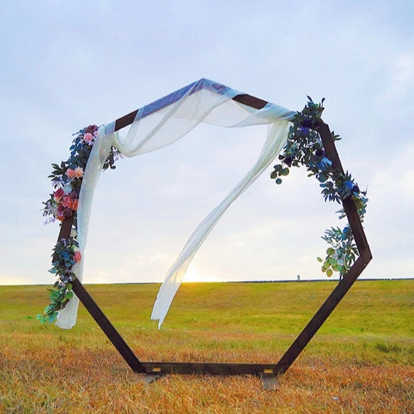 Heptagonal wooden arch, versatile for various occasions, with diverse designs.