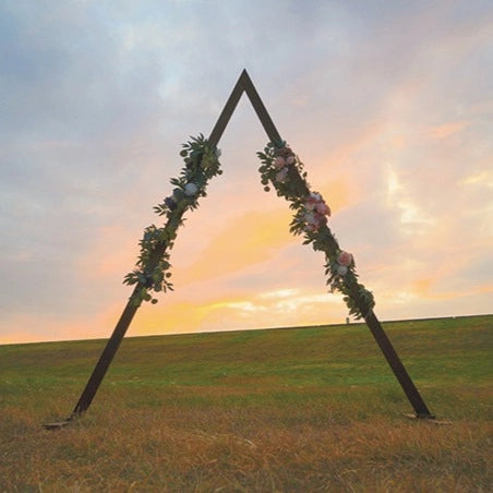 Triangle wood arch, versatile for various occasions, with diverse designs.