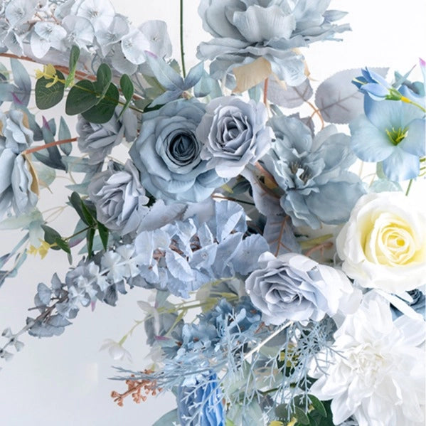 The blue white flower arch detailed view highlights its vibrant, realistic shapes and fabric backing.