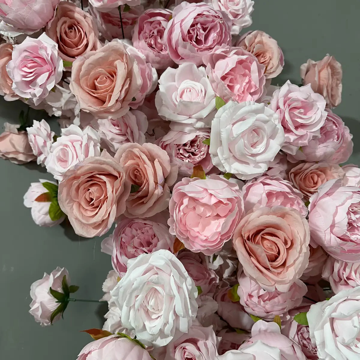 Pink artificial roses flower arch.