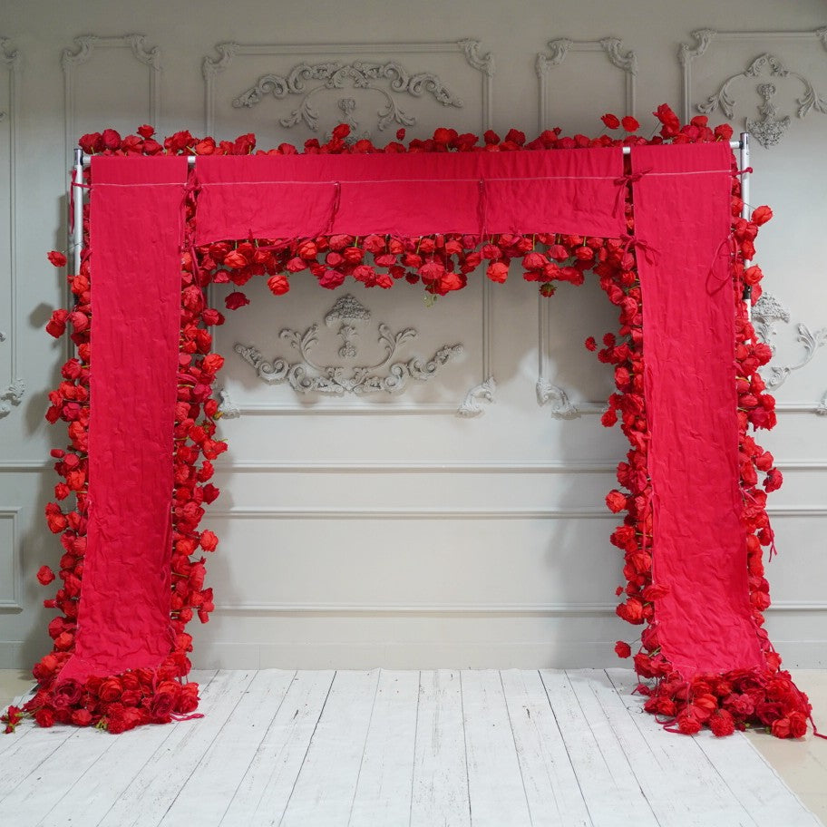 The red roses flower wall looks warm and romantic.