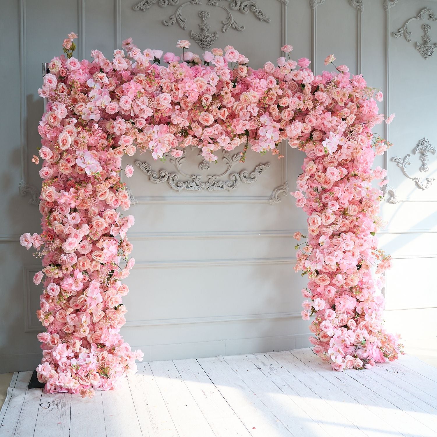The pink roses flower wall looks cute and romantic.