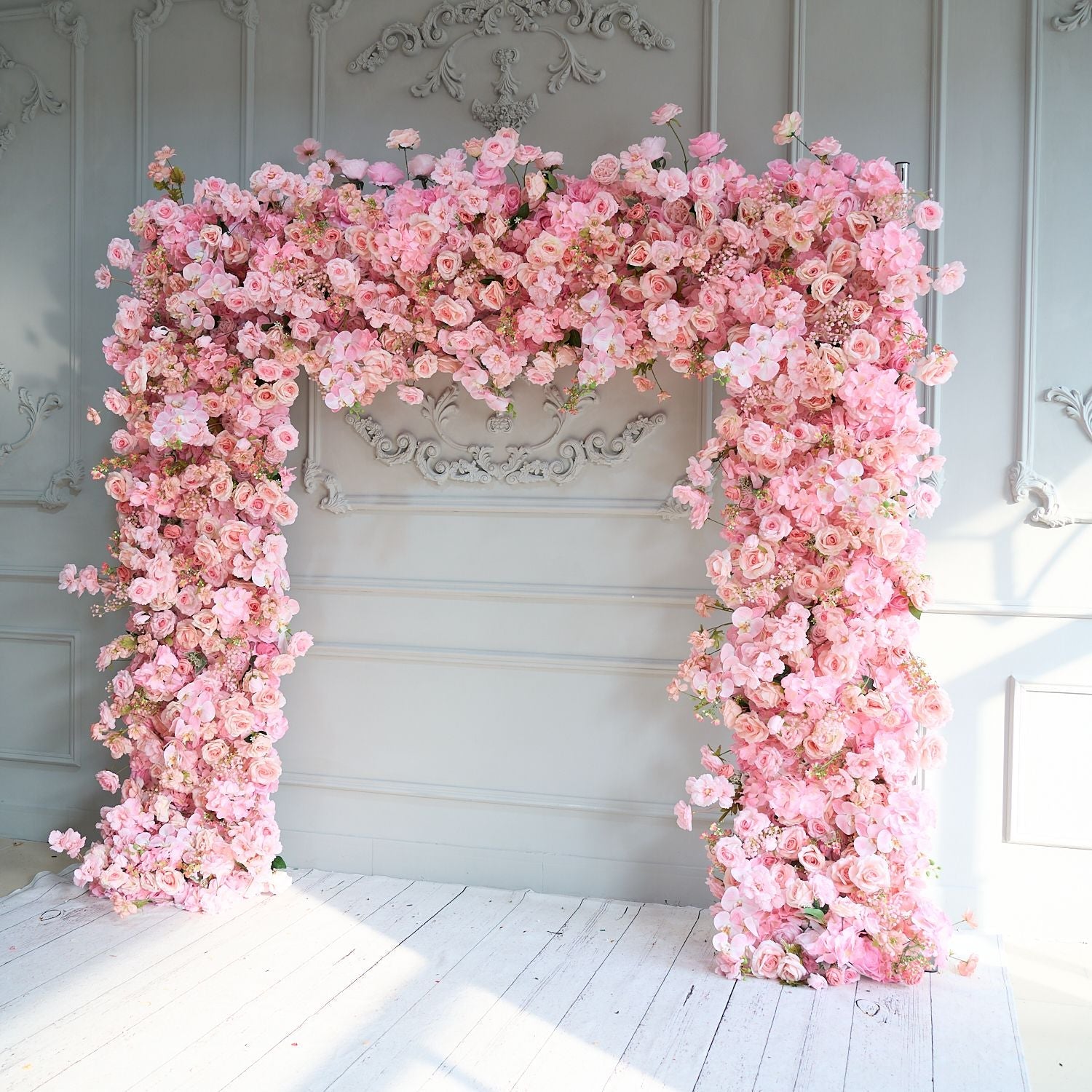 The pink roses flower wall looks cute and romantic.