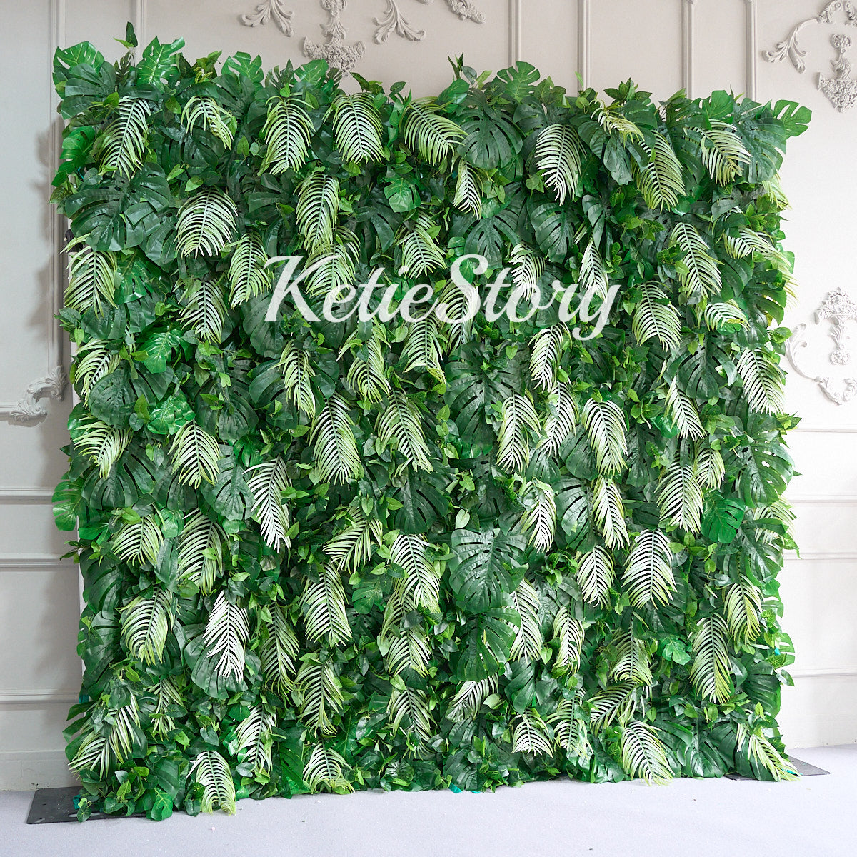 The rainforest fabric flower wall backdrop looks vibrant.