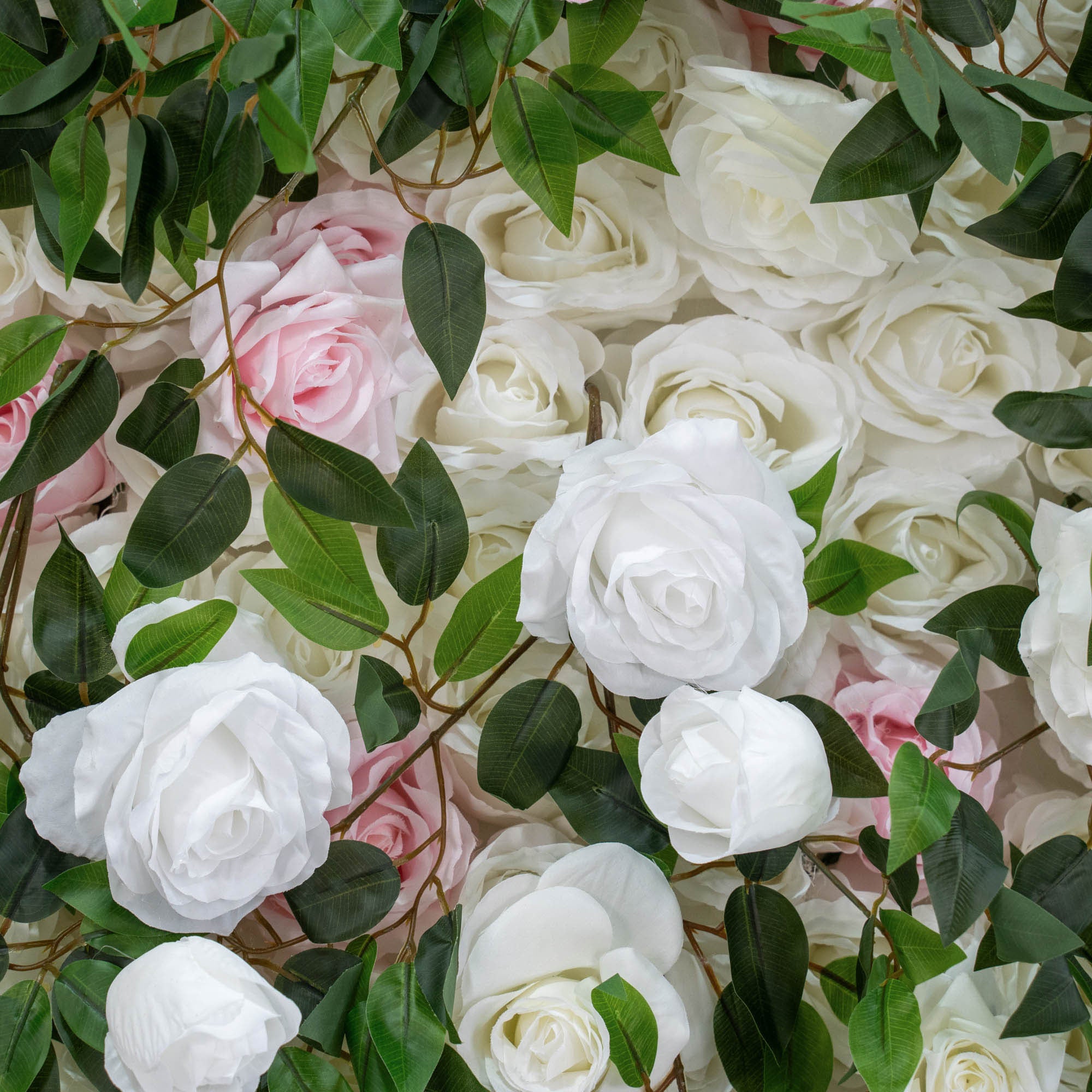 The green pink flower wall's detailed view highlights its vibrant, realistic shapes and fabric backing.