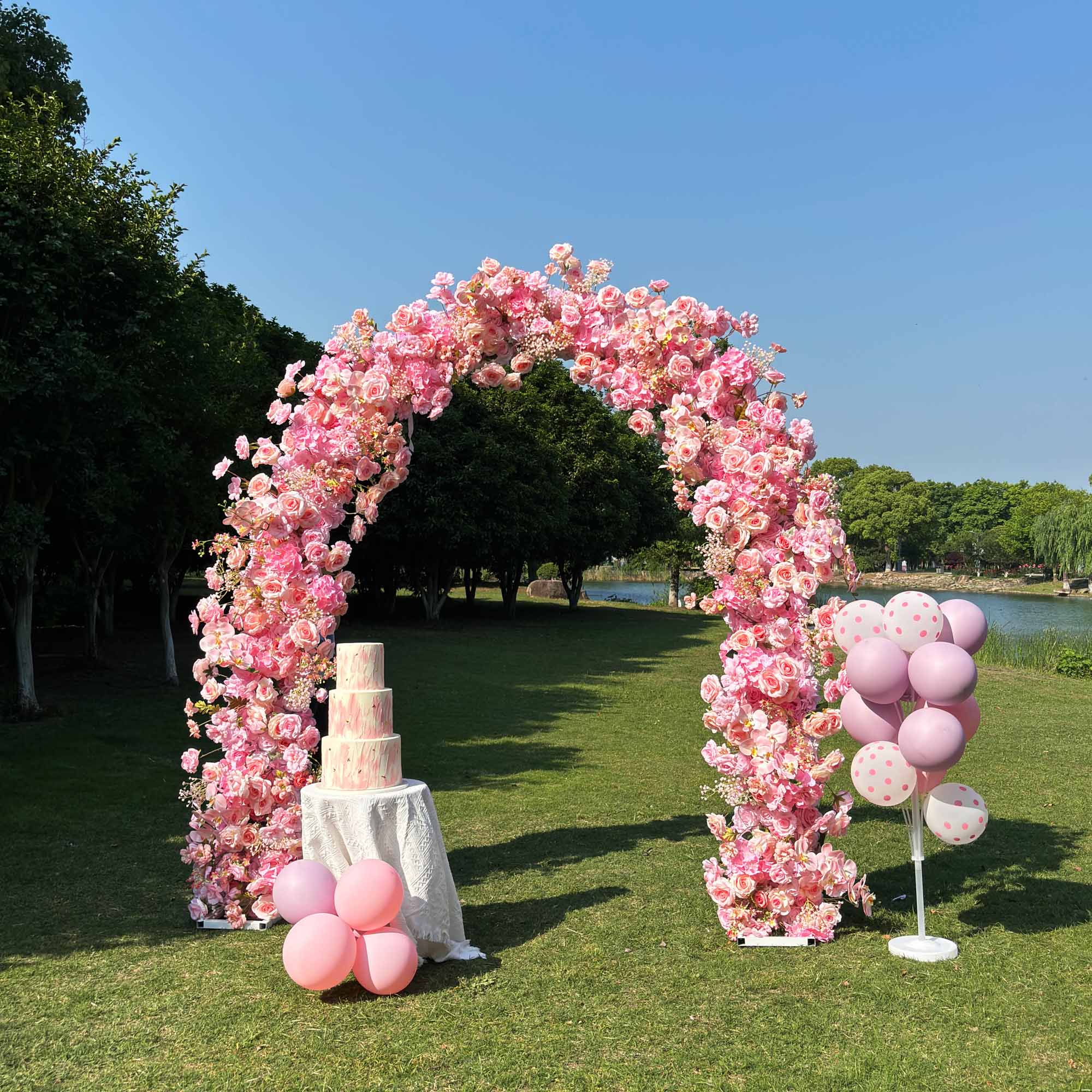 6.5*8ft Pink arch decorated with balloons and cake tower