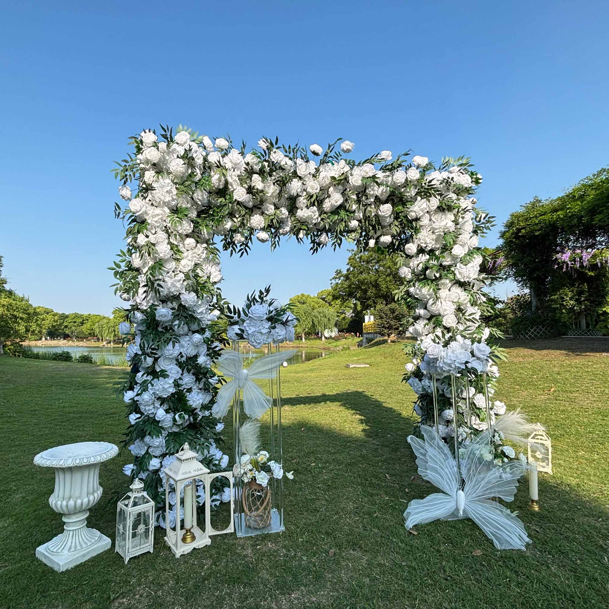 The 8x8ft white green roses flower arch side view is designed for realism and durability with a fabric backing.