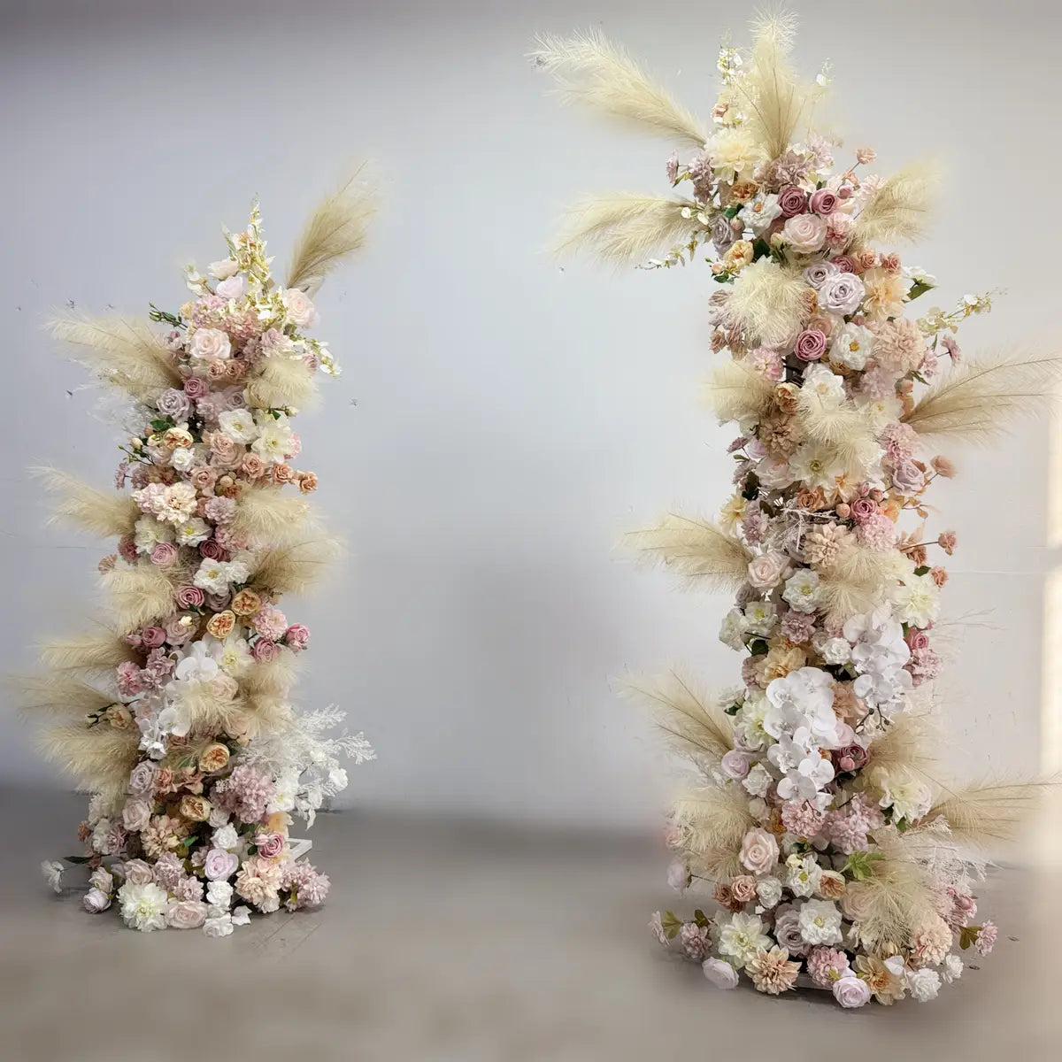 Wedding floral arch with feather.