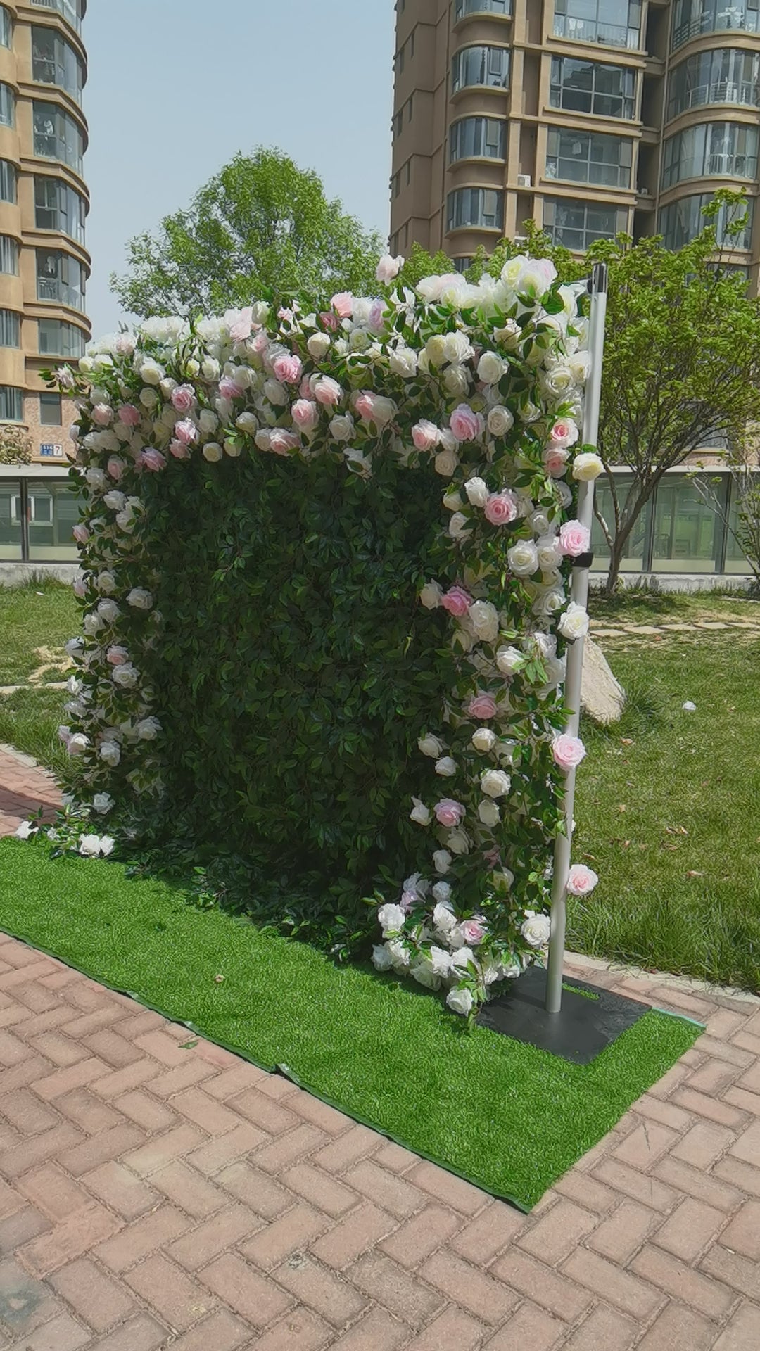 The pink white peony green leaves fabric flower wall looks full of life. 