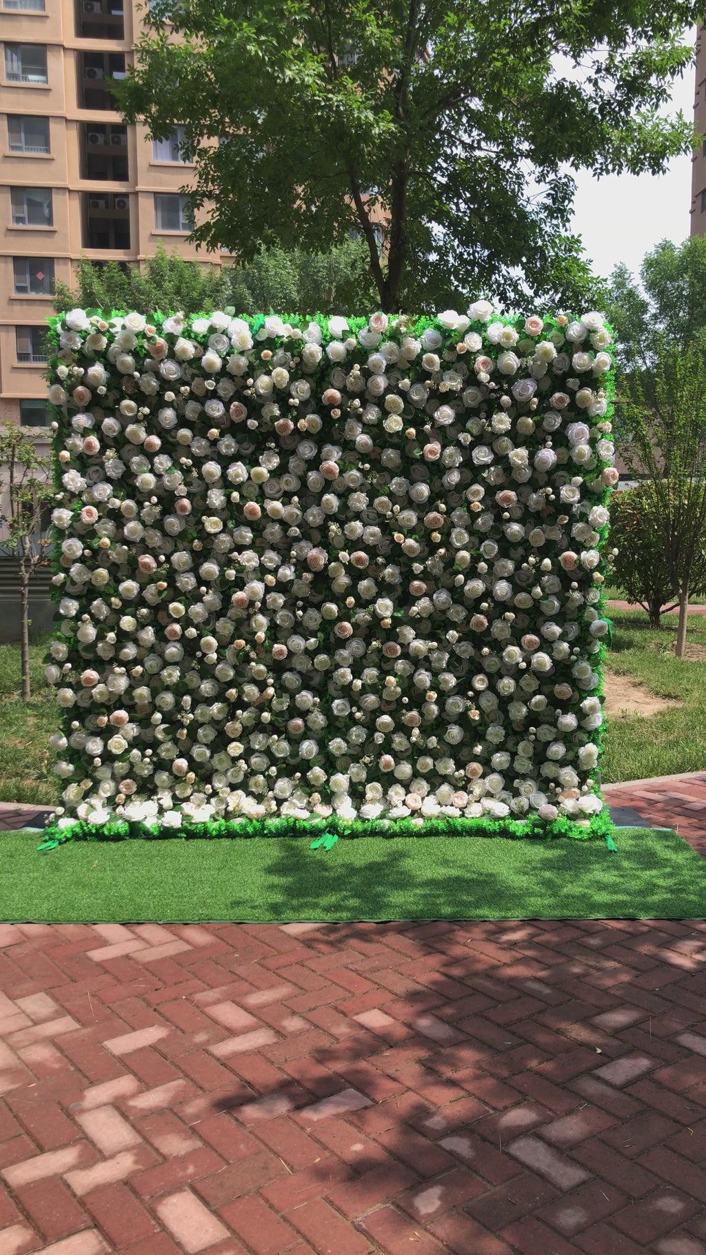The champagne rose green fabric flower wall looks elegant and beautiful.