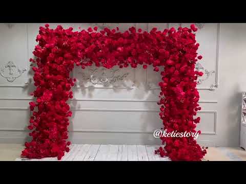 The red roses flower wall looks warm and romantic.